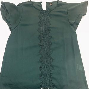 Festive green blouse perfect for the holiday season